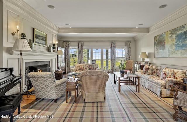 147 Moadock Rd, Millerton, NY 12546 - living room with a warm lit fireplace, ornamental molding, and recessed lighting