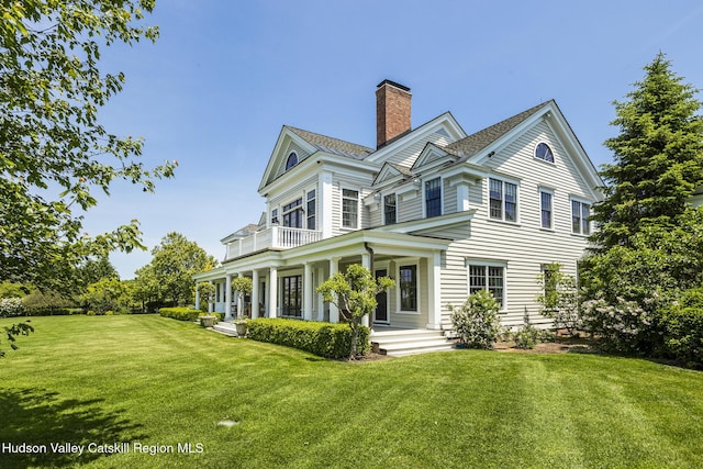 147 Moadock Rd, Millerton, NY 12546 - view of property exterior featuring covered porch, a balcony, a chimney, and a yard