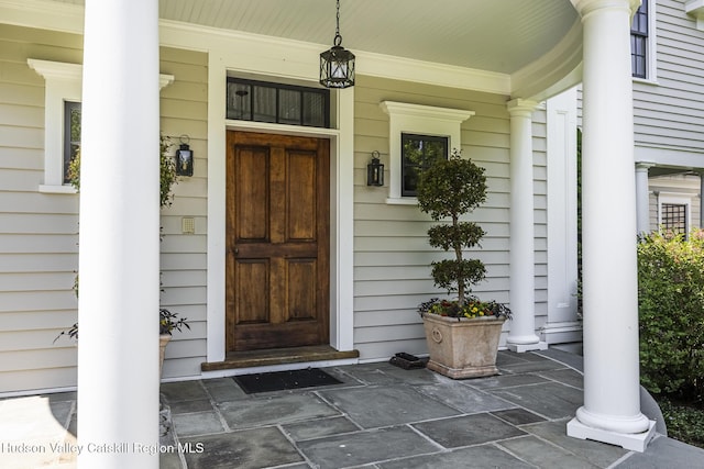 147 Moadock Rd, Millerton, NY 12546 - doorway to property featuring covered porch
