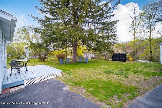 view of yard with a deck
