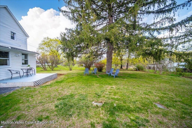 view of yard with a wooden deck