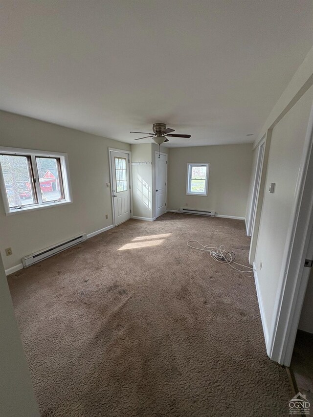 1013 Plank Rd, Averill Park, NY 12018 - unfurnished bedroom featuring baseboard heating, carpet, baseboards, and ceiling fan