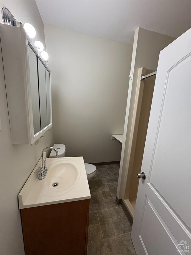 1013 Plank Rd, Averill Park, NY 12018 - full bath featuring vanity, toilet, a shower, and baseboards