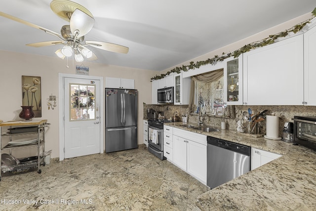 60-62 Stony Rd, Accord, NY 12404 - kitchen featuring glass insert cabinets, decorative backsplash, appliances with stainless steel finishes, white cabinets, and a sink