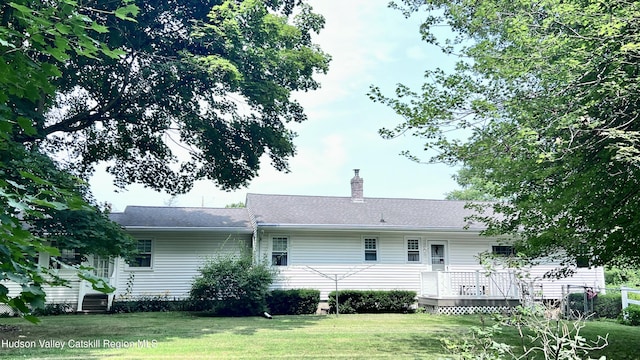 252 Rte 199, Red Hook, NY 12571 - rear view of property featuring a yard, a wooden deck, and a chimney
