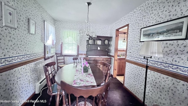 252 Rte 199, Red Hook, NY 12571 - dining room featuring wallpapered walls, healthy amount of natural light, a chandelier, a baseboard heating unit, and a wainscoted wall