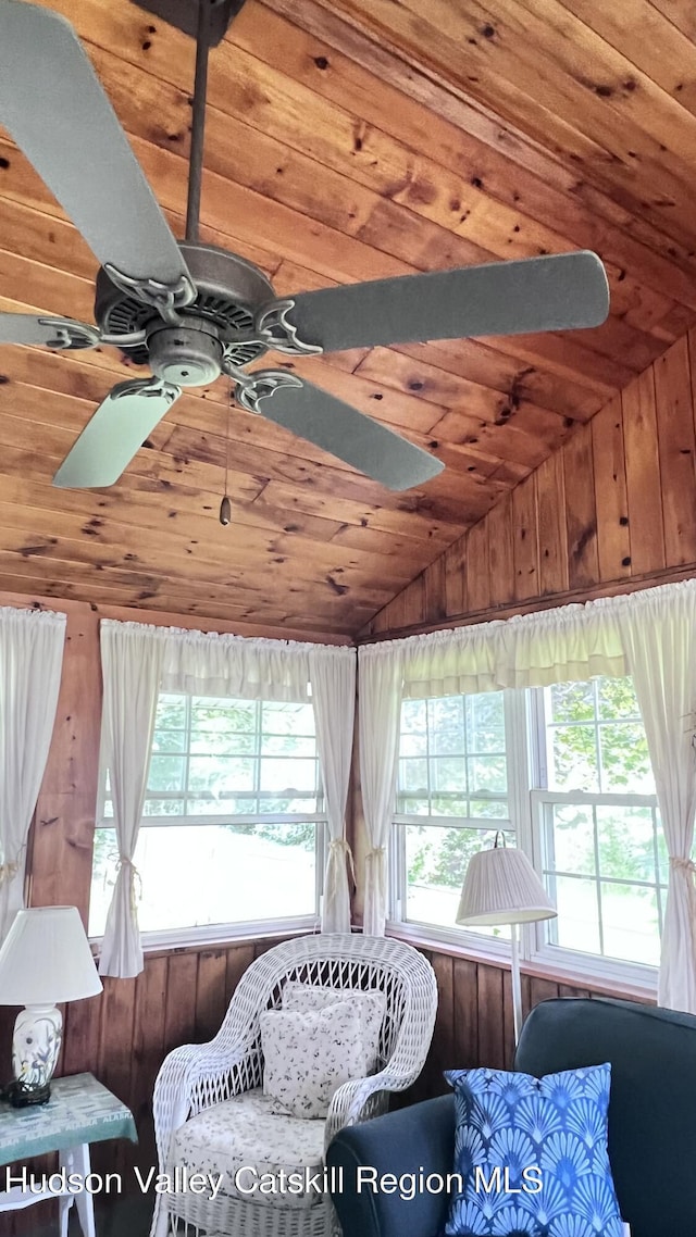 252 Rte 199, Red Hook, NY 12571 - living area with ceiling fan, vaulted ceiling, wooden ceiling, and wood walls
