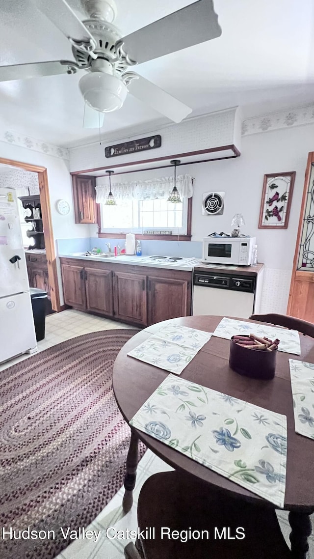 252 Rte 199, Red Hook, NY 12571 - kitchen with white appliances, ceiling fan, and light countertops