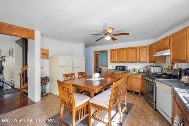 17 Boice Mill Rd, Kerhonkson, NY 12446 - kitchen with under cabinet range hood, appliances with stainless steel finishes, washer / clothes dryer, ceiling fan, and brown cabinetry