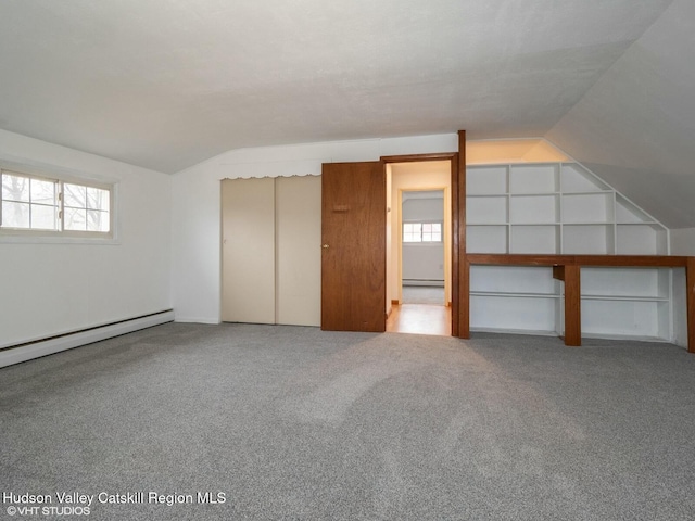 bonus room with plenty of natural light, carpet, and lofted ceiling