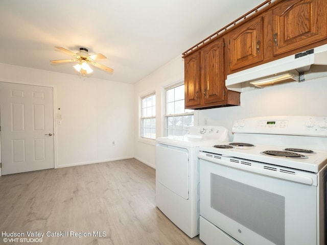 kitchen featuring ceiling fan, under cabinet range hood, brown cabinets, light wood-style flooring, and electric range