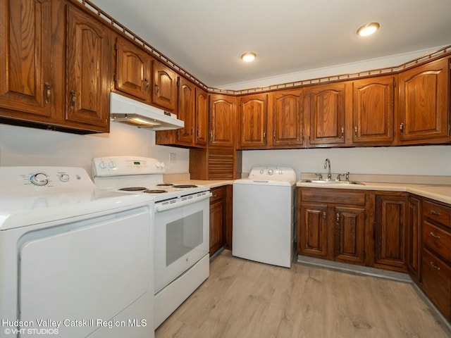 kitchen featuring light wood-style flooring, under cabinet range hood, brown cabinets, white electric range, and a sink