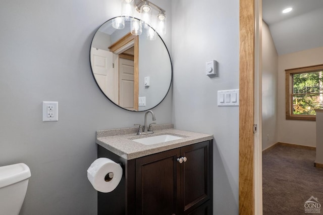 106 Earles Ln, Gilboa, NY 12076 - bathroom featuring vanity, toilet, baseboards, and lofted ceiling