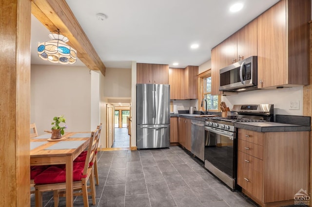 106 Earles Ln, Gilboa, NY 12076 - kitchen with stainless steel appliances, dark countertops, a sink, and recessed lighting