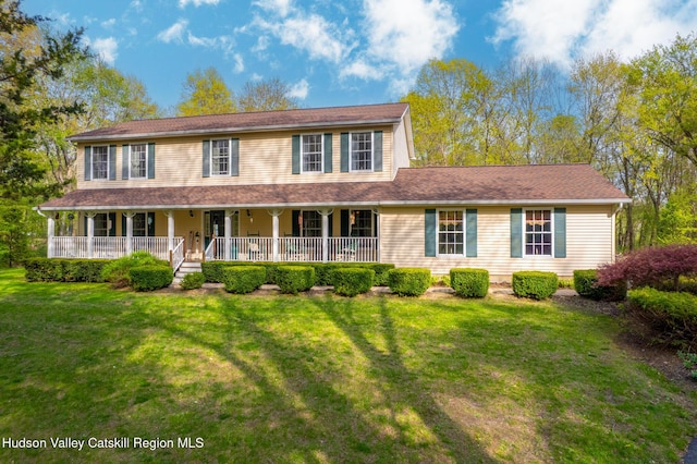 319 Garrison Woods Ln, Wallkill, NY 12589 - view of front of property with a porch and a front lawn