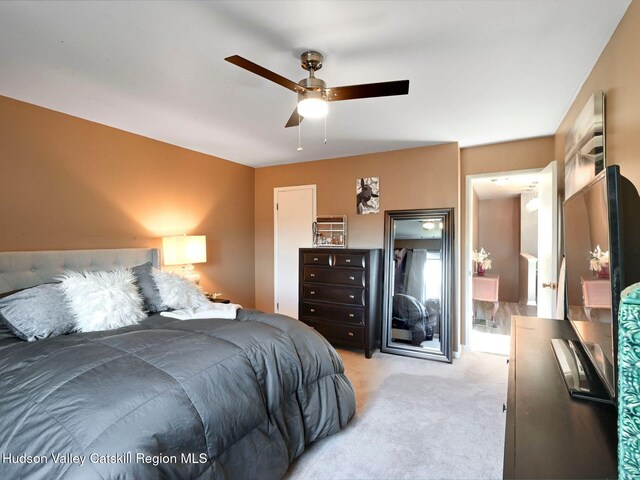 carpeted bedroom featuring ceiling fan