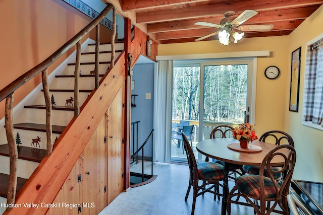 dining area with ceiling fan, beamed ceiling, and wood ceiling