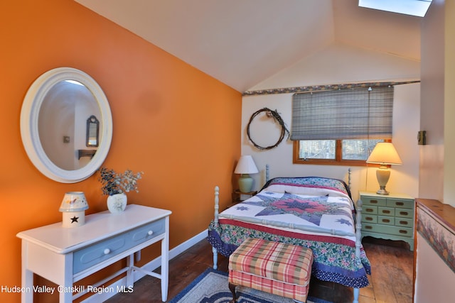 bedroom with wood-type flooring and lofted ceiling