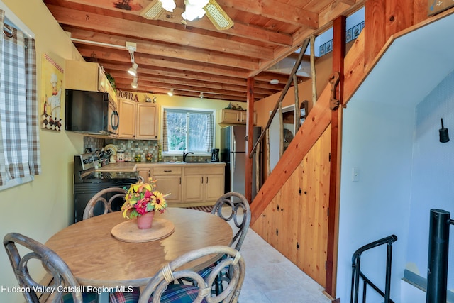 dining space featuring beam ceiling, ceiling fan, sink, and wood ceiling