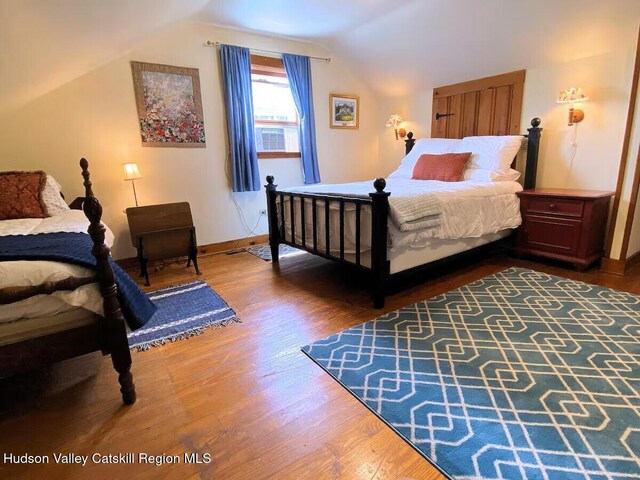 76 Smith Rd, Preston Hollow, NY 12469 - bedroom featuring lofted ceiling, wood finished floors, and cooling unit