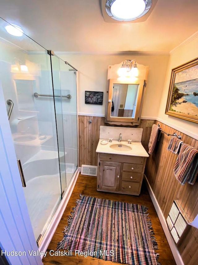 76 Smith Rd, Preston Hollow, NY 12469 - bathroom with a wainscoted wall, wood finished floors, a stall shower, vanity, and ornamental molding