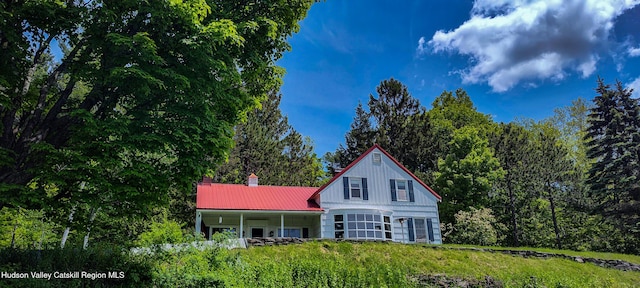 76 Smith Rd, Preston Hollow, NY 12469 - view of front of home with a metal roof and a porch
