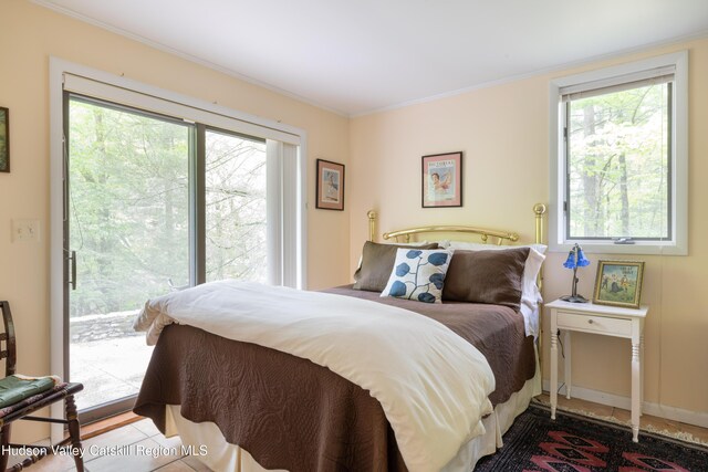 494 Edwards Rd, Monticello, NY 12701 - bedroom with access to outside, multiple windows, and ornamental molding