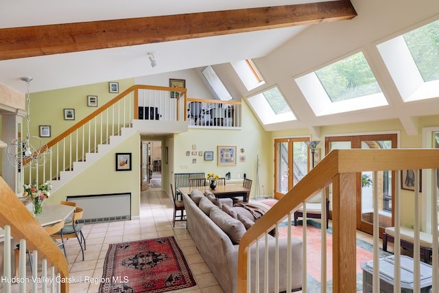 494 Edwards Rd, Monticello, NY 12701 - living room with plenty of natural light, a skylight, light tile patterned floors, stairway, and beamed ceiling