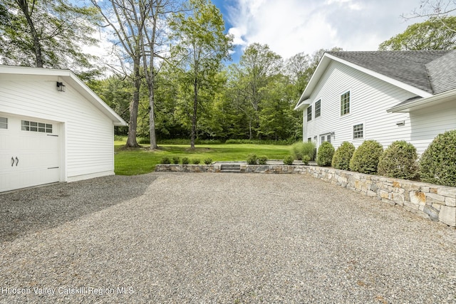 view of yard featuring a garage