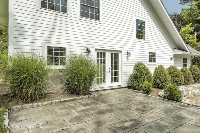 rear view of house with french doors and a patio