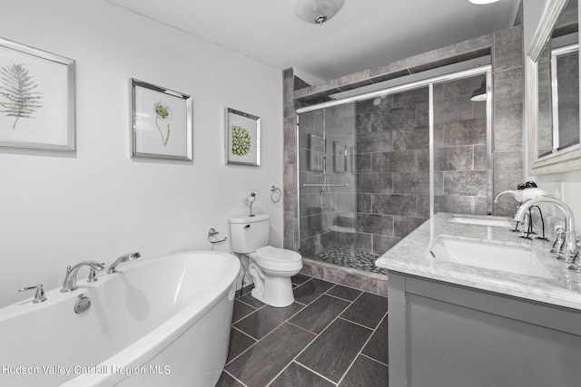 full bathroom featuring shower with separate bathtub, vanity, and toilet