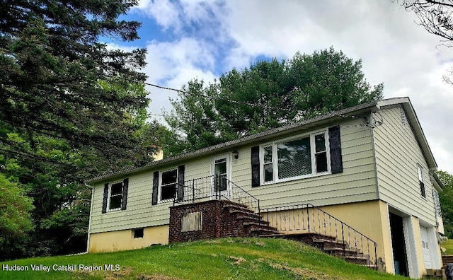 22 Katzman Rd, Ellenville, NY 12428 - view of front facade with stairs, a chimney, and a front lawn