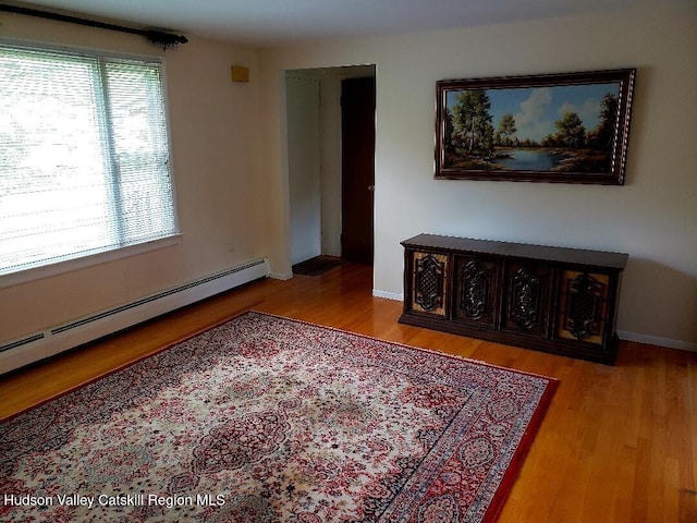 22 Katzman Rd, Ellenville, NY 12428 - living area with baseboard heating, light wood finished floors, and baseboards