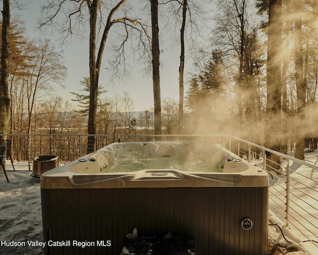 yard at dusk featuring a hot tub