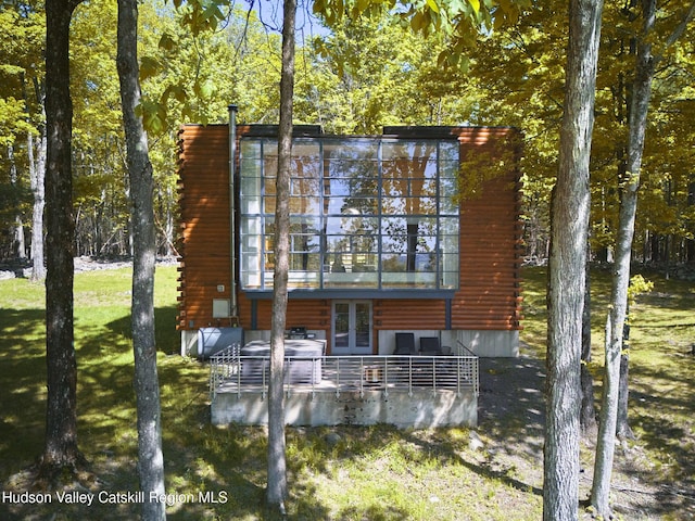 39 Hornbeck Ln, Accord, NY 12404 - back of property with log siding, french doors, and a yard