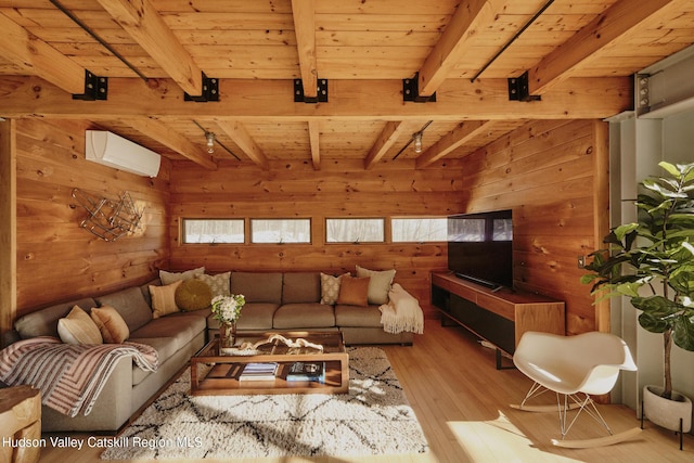 living room with wood ceiling, an AC wall unit, wooden walls, beam ceiling, and light hardwood / wood-style floors