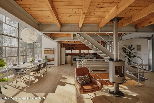 interior space featuring wood ceiling, beam ceiling, and light hardwood / wood-style floors