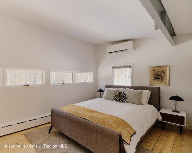 bedroom featuring beamed ceiling, a baseboard radiator, an AC wall unit, and wood-type flooring