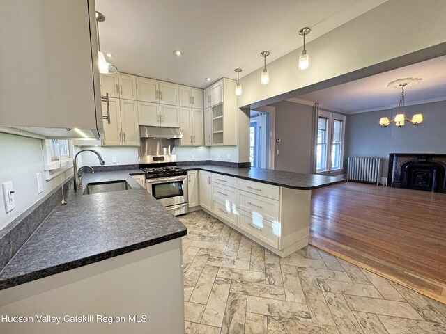 11 W Bridge St, Saugerties, NY 12477 - kitchen featuring appliances with stainless steel finishes, under cabinet range hood, recessed lighting, decorative light fixtures, and white cabinets