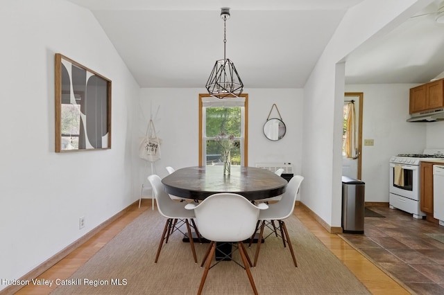 194 High Falls Rd, Saugerties, NY 12477 - dining space featuring vaulted ceiling, baseboards, and wood finished floors