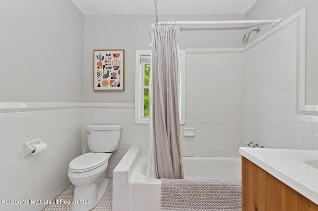 194 High Falls Rd, Saugerties, NY 12477 - full bathroom featuring tile walls, toilet, vanity, tile patterned flooring, and tiled shower / bath