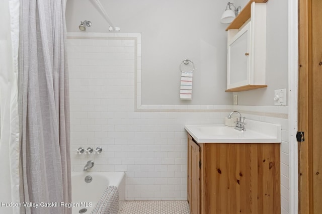 194 High Falls Rd, Saugerties, NY 12477 - full bath featuring tile walls, vanity, tile patterned floors, shower / bath combo, and a wainscoted wall