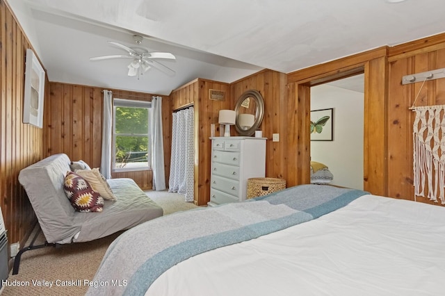 194 High Falls Rd, Saugerties, NY 12477 - bedroom with carpet flooring, wooden walls, vaulted ceiling, and a ceiling fan