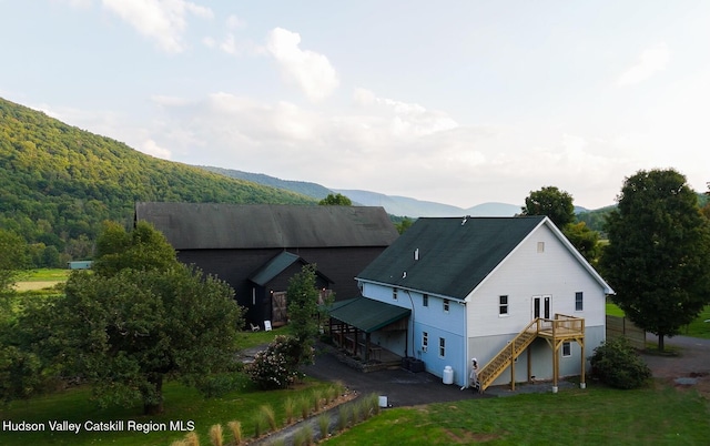 394 Macmore Rd, Roxbury, NY 12474 - view of side of property with stairs, a deck with mountain view, and a lawn