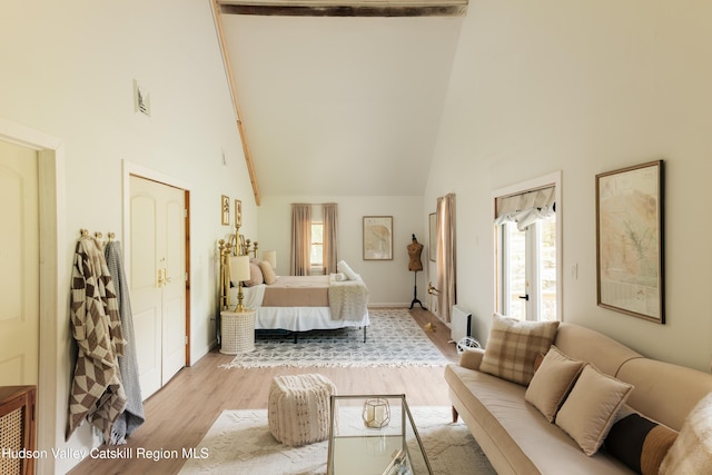 394 Macmore Rd, Roxbury, NY 12474 - bedroom with high vaulted ceiling, multiple windows, light wood-style floors, and baseboards