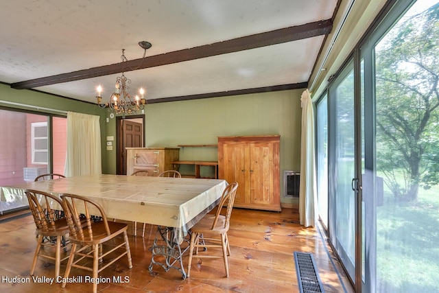 18 Maplewood Ave, Windham, NY 12496 - dining area featuring beamed ceiling, a chandelier, and light wood-style flooring
