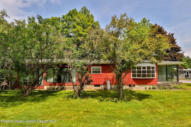 18 Maplewood Ave, Windham, NY 12496 - rear view of house with a lawn and a sunroom