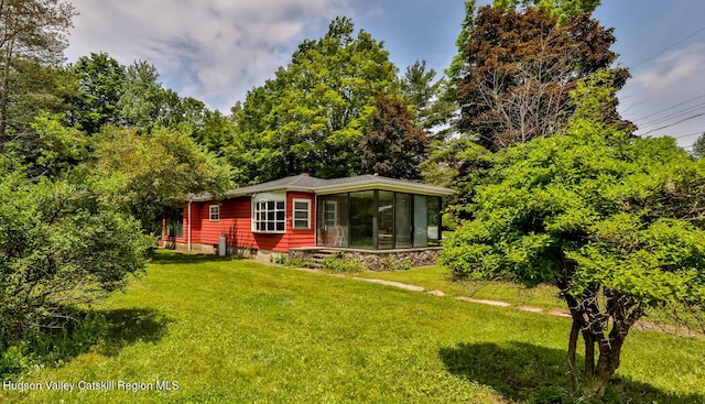 18 Maplewood Ave, Windham, NY 12496 - view of front of home featuring a front yard and a sunroom
