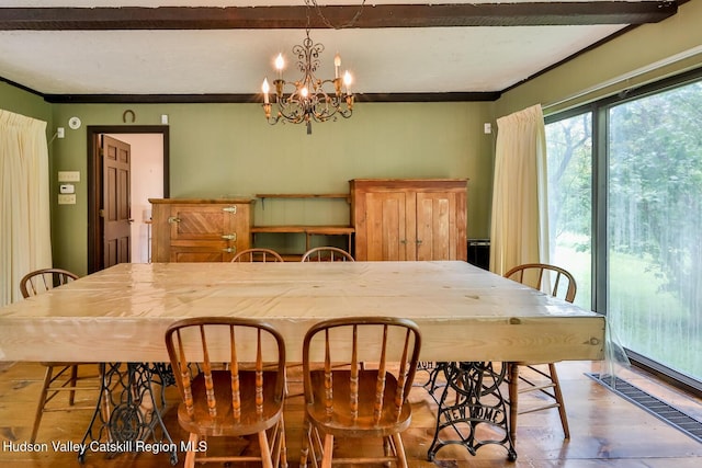18 Maplewood Ave, Windham, NY 12496 - dining space featuring a chandelier, ornamental molding, and wood finished floors