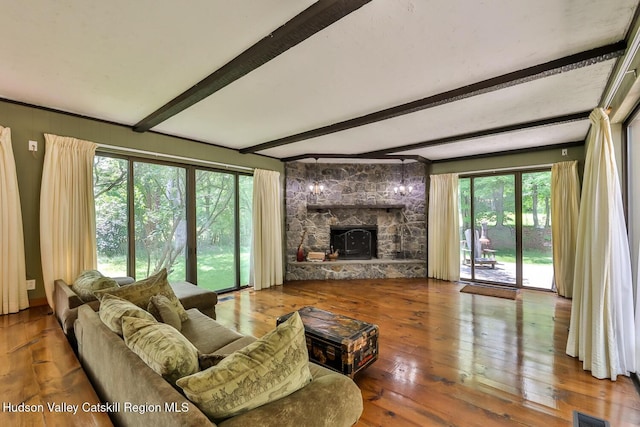 18 Maplewood Ave, Windham, NY 12496 - living room with beam ceiling, wood-type flooring, and a fireplace